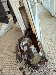 corroded sliding door rollers removed during repair