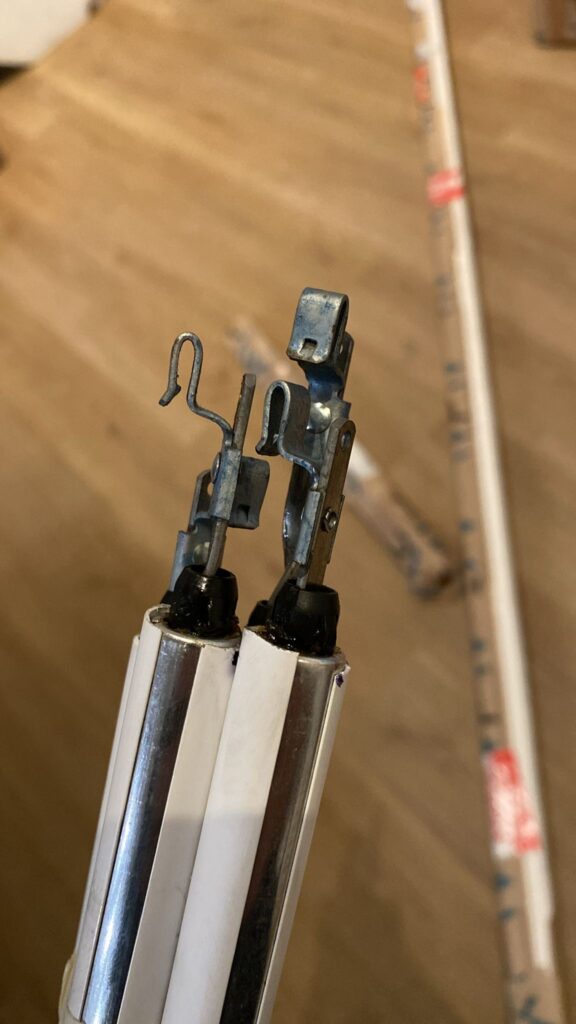 Window balance spring assemblies inside an aluminum window channel during replacement